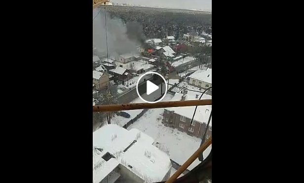 Из кабины подъемного крана сняли крупный пожар в Киеве